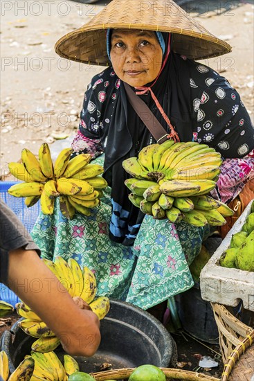 Traditional authentic food market, vendor, woman, fruit, vegetable, fresh, food, nutrition, sale, trade, bazaar, authentic, disease vector, food law, food control, stall, Asian, vegetable market, local, hygiene, virus, tradition, traditional, health, marketplace, market hall, tropical, travel, tourism, culture, poverty, presentation, cleanliness, person, Muslim, Islam, Lombok, Indonesia, Asia