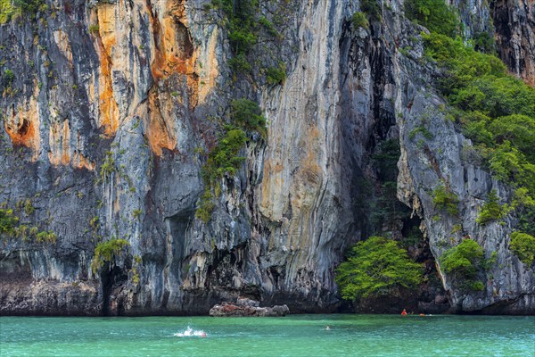 Chalk cliffs with lagoon near Krabi, weather, sky, climbing rocks, climbing, mountain, hill, mountainous, rainforest, nature, island, travel, tourism, climate, snorkelling, swimming, bathing, bathing holiday, beach holiday, tropical, season, holiday, exotic, sun, sunny, blue sky, travel photo, rocks, rocky, sandstone cliffs, coast, coastal landscape, landscape, nature, natural landscape, Siam, paradise, holiday paradise, limestone cliffs, Railay beach, Phuket, Thailand, Asia