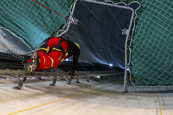 Height rescuers from the Oberhausen professional fire brigade practise abseiling from a wind turbine from a height of 150 metres, ascent into the turbine, to the nacelle, Issum, North Rhine-Westphalia, Germany, Europe