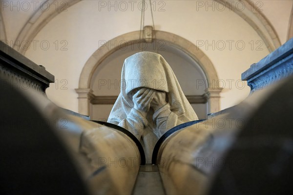 Monastery of Sao Vicente de Fora, Royal Pantheon of the Braganca family, Sculpture of a woman praying in front of the tomb of Carlos I, Lisbon, Portugal, Europe