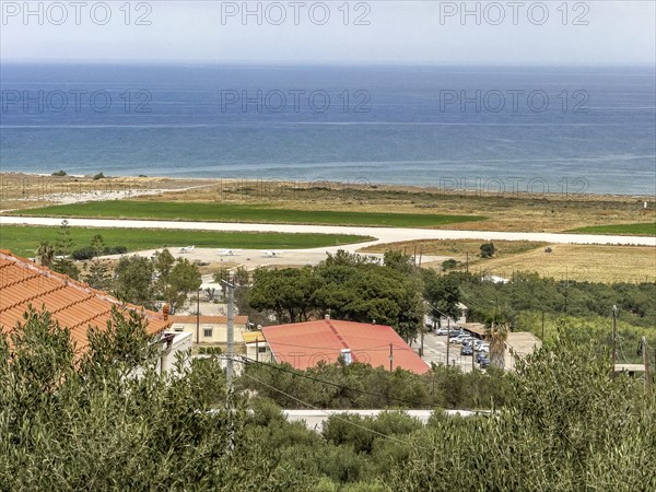 View from military cemetery hill height 107 near Maleme on runway landing strip from today small not public used sports airfield of Chania Aeroclub in World War II contested military airfield on north coast of Crete, Maleme, Crete, Greece, Europe