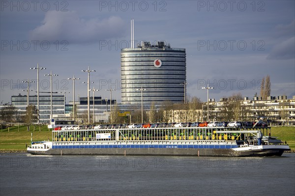 The Rhine at Neuss Vodafone building, cargo ship, vehicle transporter Fuerte, of BLG Autotransport Logistics, North Rhine-Westphalia, Germany, Europe