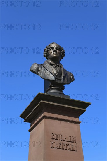 Monument in honour of Conradin Kreutzer, musician, conductor and composer, bust by Hans Baur, sculptor, sculpture, portrait, portrait, head, face, detail, pedestal, writing, letters, public art, statue, Meßkirch, district of Sigmaringen, Baden-Württemberg. Germany