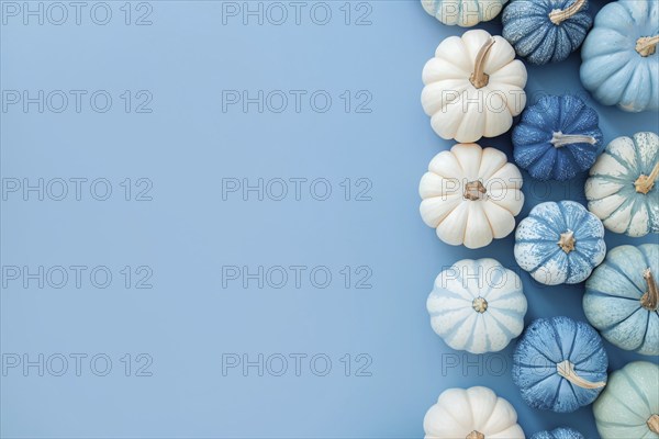 Top view of white and blue pumpkins on pastel blue background with copy space. Generative Ai, AI generated