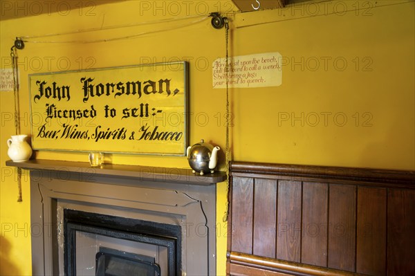 Traditional interior of Kings Head village pub, the Low House, Laxfield, Suffolk, England, UK bell cord for service