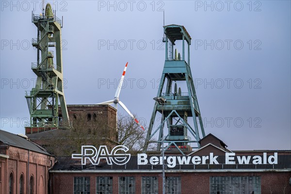 Former RAG Ewald mine, headframes, shaft 7, right and shaft 2, left, behind the wind power station on the Hoppenbruch spoil tip in Herten, North Rhine-Westphalia, Germany, Europe