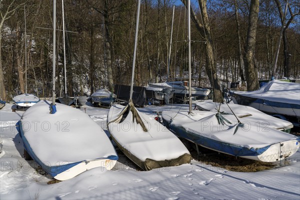 Sailing boats, on the western shore of Lake Baldeney, near the former Carl Funke colliery, winter, snowy, Essen, North Rhine-Westphalia, Germany, Europe