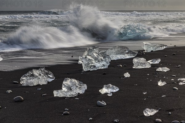 Ice floes on the beach, waves, clouds, winter, Diamond Beach, Breidamerkursandur, Jökulsarlon, Iceland, Europe