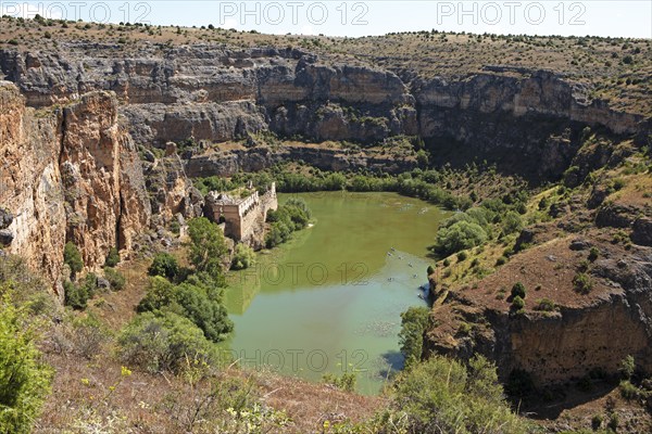 Canoes in the gorge on the Duratón river, on the left the Franciscan monastery of La Hoz, Hoces del Rio Duratón nature park Park, Segovia province, Castile and Leon, Spain, Europe