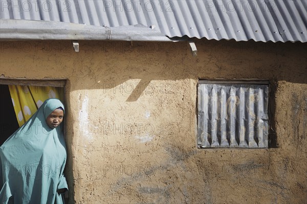 Young woman at her house in the community in Maraban Dare, 07/02/2024