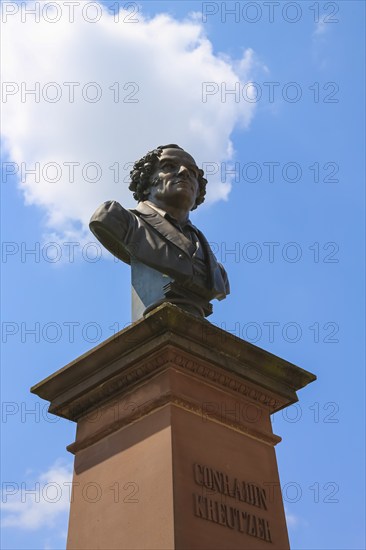 Monument in honour of Conradin Kreutzer, musician, conductor and composer, bust by Hans Baur, sculptor, sculpture, portrait, portrait, head, face, detail, pedestal, writing, letters, public art, statue, cloud, Meßkirch, district of Sigmaringen, Baden-Württemberg. Germany