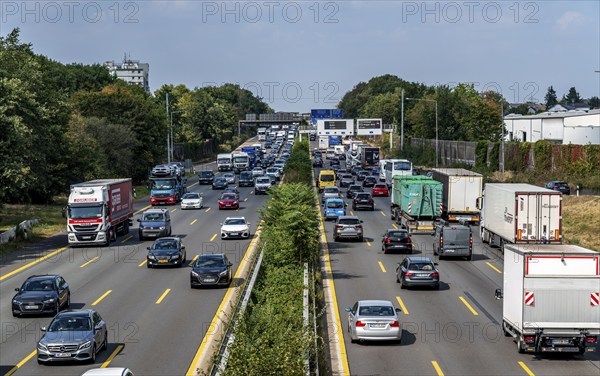 Traffic jam on the A3 motorway, over 8 lanes, in both directions, in front of the Leverkusen motorway junction, Friday afternoon high traffic volume, roadworks, gantry signs with journey times, delays due to the traffic jam, Leverkusen, North Rhine-Westphalia, Germany, Europe