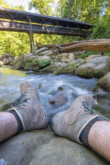 The Irrel Waterfalls, rapids in the lower reaches of the Prüm, covered wooden bridge for hikers, between Prümzurlay and Irrel, in the Eifel district of Bitburg-Prüm, Rhineland-Palatinate. Germany