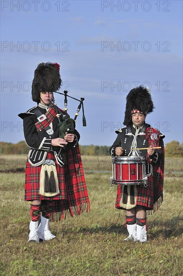 Scottish bagpipers playing pipes and drums, Scotland, UK