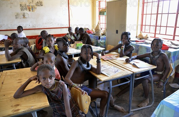 Himba pupils sitting in a classroom at the Omohanga Primary School, Himba school, Omohanga, Kaokoland, Kunene, Namibia, Africa