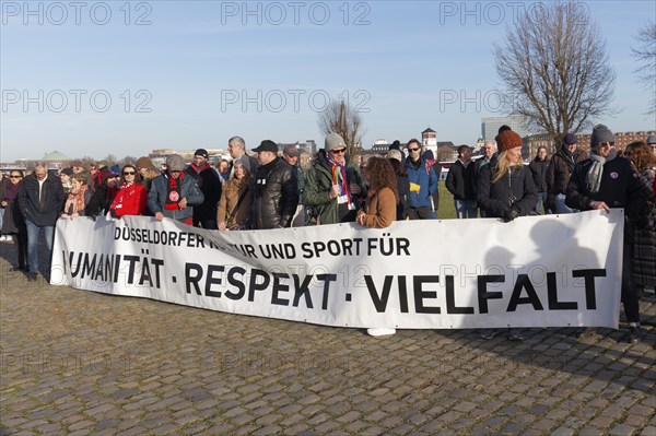 People holding banner, inscription Humanity, Respect, Diversity, large demonstration against right-wing extremism and AfD on 27 January 2024 in Düsseldorf, North Rhine-Westphalia, Germany, Europe