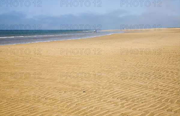 Small waves breaking on wide sandy beach at Hunstanton, north Norfolk coast, England, United Kingdom, Europe