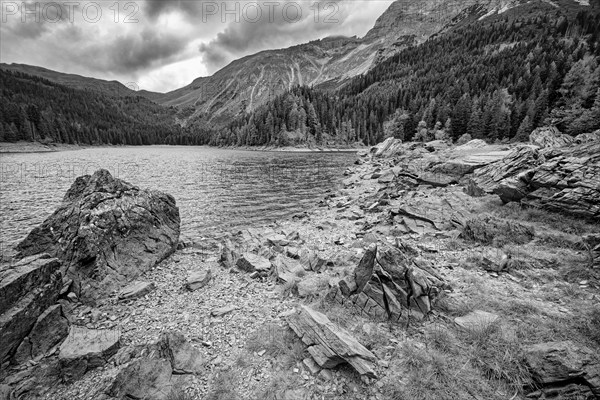 Obernberger See, mountain lake, landscape of the Stubai Alps, weather mood, cloud mood, black and white photo, Obernberg am Brenner, Tyrol, Austria, Europe