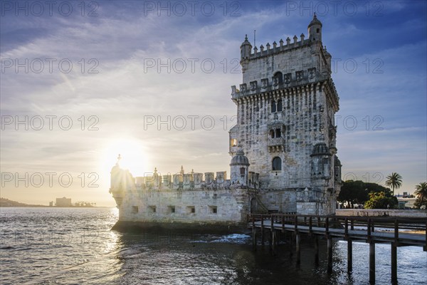 Belem Tower or Tower of St Vincent, famous tourist landmark of Lisboa and tourism attraction, on the bank of the Tagus River Tejo on sunset. Lisbon, Portugal, Europe