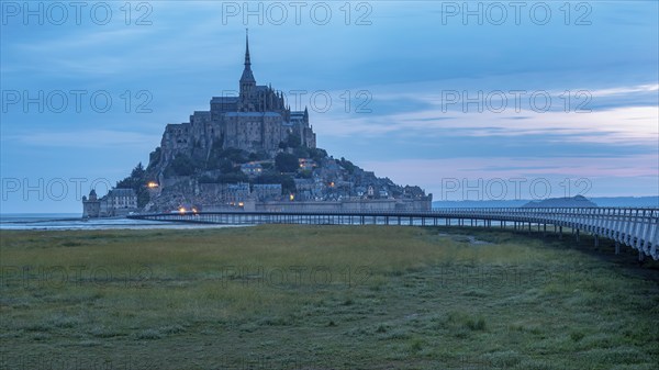 Mont Saint Michel in front of sunrise, rocky monastery island in the Wadden Sea, Le Mont Saint Michel, Normandy, France, Europe