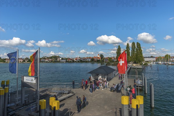 Immenstaad on Lake Constance, townscape, jetty, flags, name plate, blue sky, Baden-Württemberg, Germany, Europe