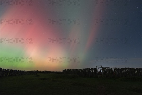 Northern lights (aurora borealis) over the ring sanctuary of Pömmelte, prehistoric circular ditch complex, also known by archaeologists as the German Stonehenge, Pömmelte, Saxony-Anhalt, Germany, Europe