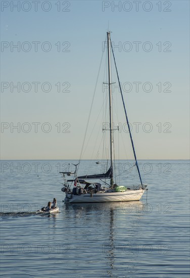 Sailboat at anchor on a calm sea, Baltic Sea off Ystad, Skåne County, Sweden, Scandinavia, Europe