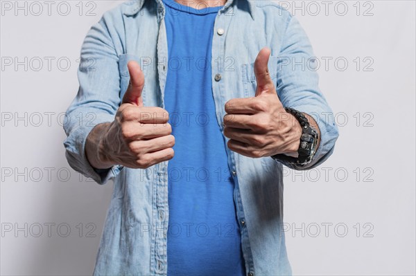 Person hands with thumbs up doing ok, Close up of man hands doing thumbs up, People with thumbs up on isolated background