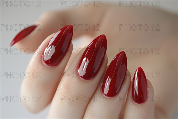 Woman's almond style shaped fingernails with red nail polish. KI generiert, generiert, AI generated