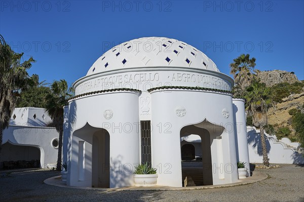 Round white building with domed roof and Mediterranean architecture surrounded by palm trees under a blue sky, thermal springs, thermal baths, thermal baths of Kallithea, Kallithea, Rhodes, Dodecanese, Greek Islands, Greece, Europe