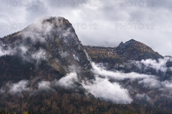 View of part of the Tennengebirge from Oberscheffau. The mountains are covered in clouds. Autumn. Salzburger Land, Upper Austria, Austria, Europe