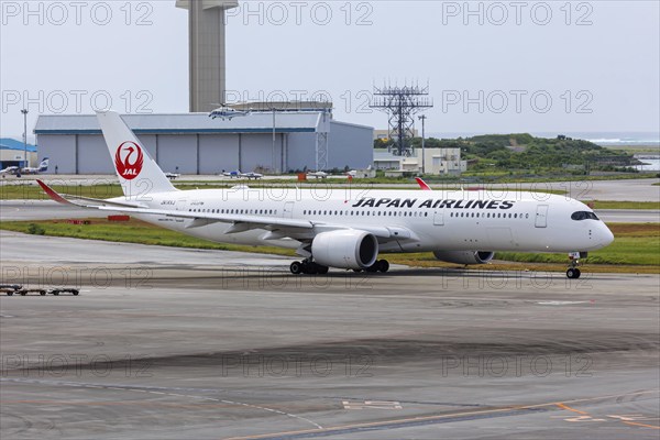 An Airbus A350-900 aircraft of JAL Japan Airlines with the registration JA14XJ at Okinawa Airport (OKA) in Naha, Japan, Asia