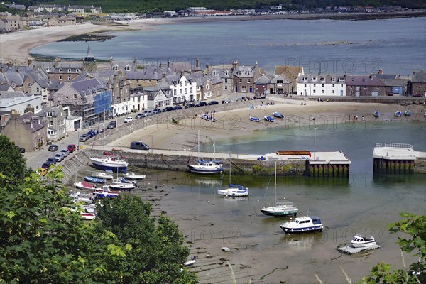 Coastal village with beach, boats and houses surrounded by hills, Stonehaven, Aberdeenshire, Scotland, United Kingdom, Europe