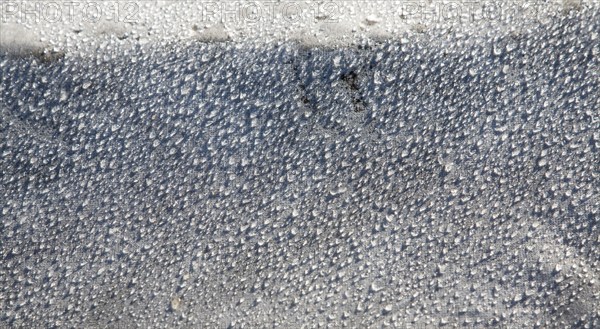 Water droplets dew condensation on fleece fabric in field