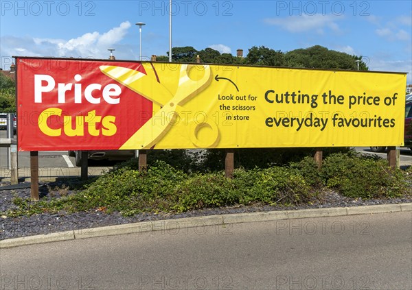 Price Cuts advertising banner sign, Morrisons supermarket, Cromer, north Norfolk, England, UK