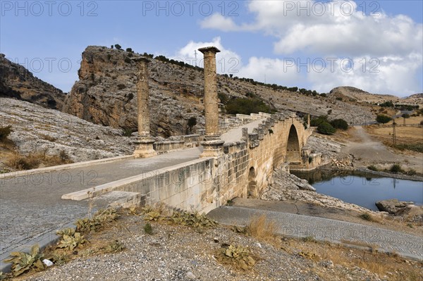 2nd century AD Severan roman bridge on the Cendere River with the columns of the Roman Emperor Septimus Severus and the Empress Julia Domna, Turkey, Asia