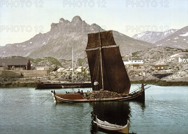 Print shows a Nordlandsbåt ship, outside of the town of Svolvær in the Lofoten district, Nordland county, Norway, View from 1885, Historic, digitally restored reproduction from a 19th century original, Record date not stated, Europe