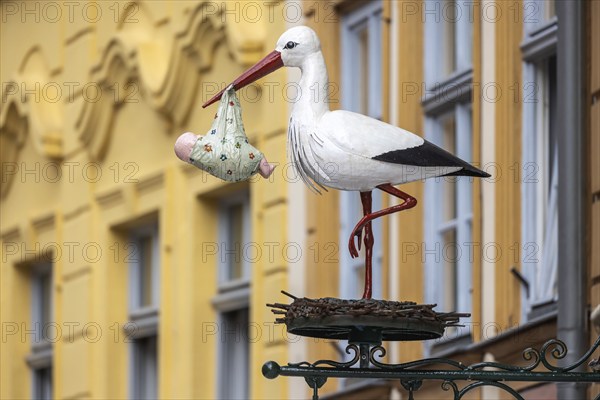 Nose sign in the old town centre of Bamberg, stork with baby. Bamberg, Upper Franconia, Bavaria, Germany, Europe