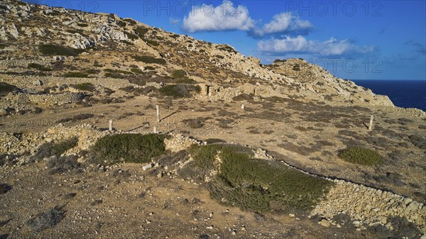 Drone shot, Archaeological site, Rocky landscape with ruins and sea view, Acropolis hill, Ruins of an acropolis, Arkasa, West coast, Karpathos, Dodecanese, Greek Islands, Greece, Europe