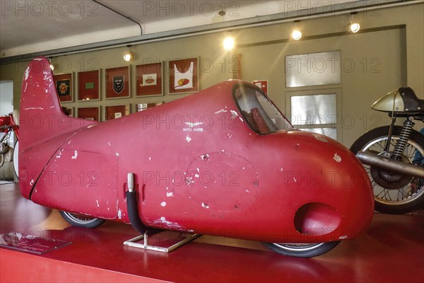 Record vehicle motorbike with red painted streamlined full fairing Model 75 Record from 1950s, Museum Moto Guzzi, Mandello di Lario, Lombardy, Italy, Europe