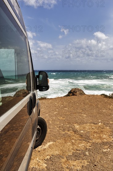 Campervan by the sea, motorhome parked on the rocky coast, coastline near La Isleta del Moro, Almeria, Cabo de Gata, Cabo de Gata-Nijar, Spain, Europe