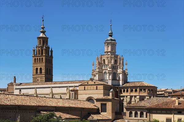 Historic church with several towers and brick facade in front of a clear blue sky, Cathedral, Catedral de Santa Maria de la Huerta, Tarazona, Zaragoza, Aragon, Spain, Europe