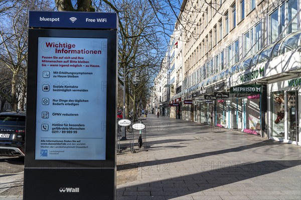 Advertising displays, on Königsallee, Kö, give advice on correct behaviour, empty city centre, shopping street, effects of the coronavirus pandemic in Germany, Düsseldorf