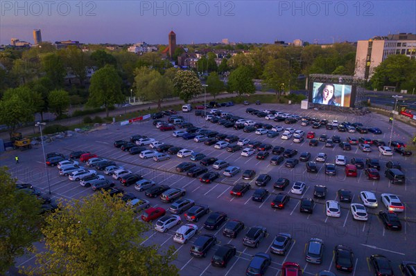 Temporary drive-in cinema, in the car park in front of Messe Essen, Grugahalle, large LED screen, in the Rüttenscheid district, effects of the corona crisis in Germany