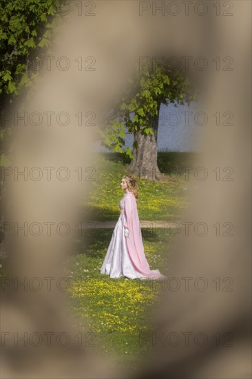 Cinderella can also be seen around Moritzburg Castle in spring. Model Tamara Kretschmer once again slipped into the coveted role of the legendary Cinderella with the ball gown, Moritzburg, Saxony, Germany, Europe