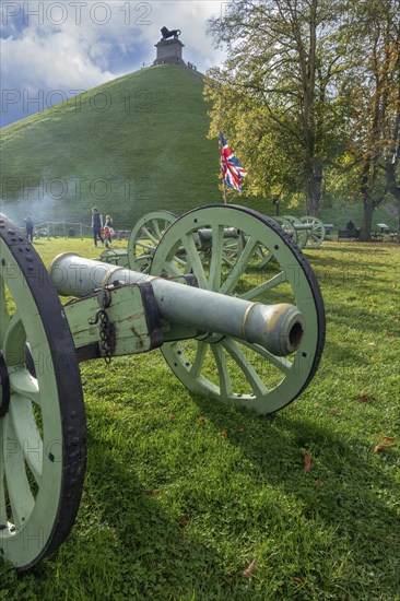 Replica of French Napoleonic war 6-pound cannons and Lion's Mound at the Domain of the Waterloo 1815 Battlefield at Braine-l'Alleud, Wallonia, Belgium, Europe