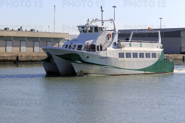 Passenger ferry boat Catamaran Bahia service arriving at Puerto de Santa de Maria, Cadiz province, Spain, Europe