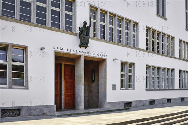 Heidelberg, Germany, June 28th 2024: Front of main building of Ruprecht-Karls-University with statue of Roman goddess of wisdom Minerva above entrance, Europe