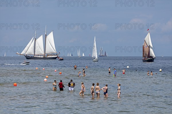 Sailing ships, sailing boats, people standing in the water, Kieler Woche, Kiel Fjord, Kiel, Schleswig-Holstein, Germany, Europe