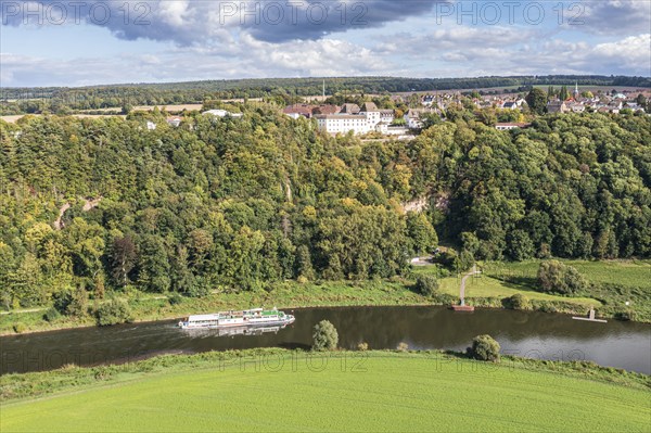 Aerial view of excursion boat on the Weser river passing castle Fürstenberg, Weserbergland, Germany, Europe